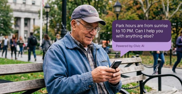 man texting on phone in the park